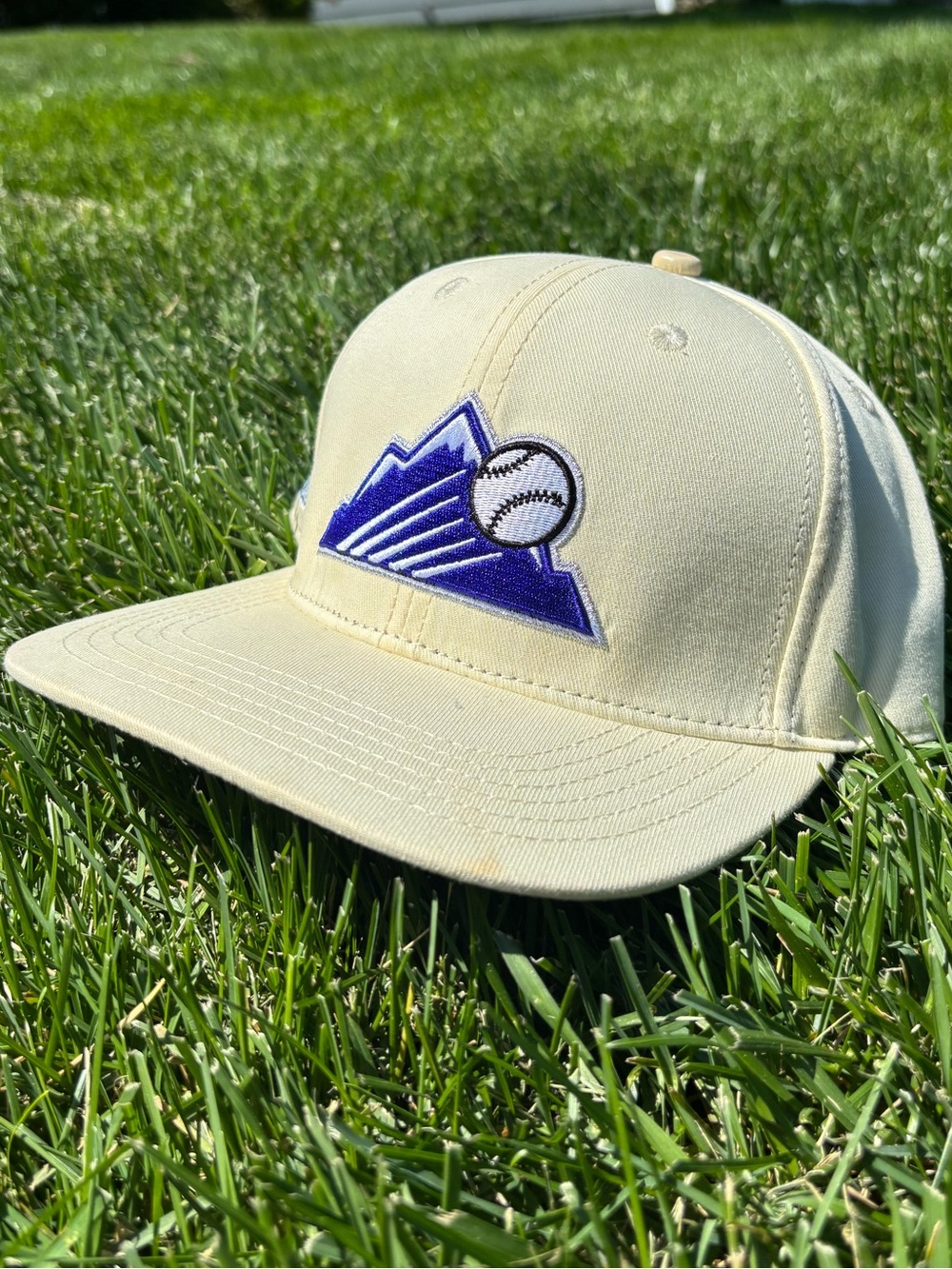 Rockies Cream Baseball Hat with Purple Mountain & Baseball Patch